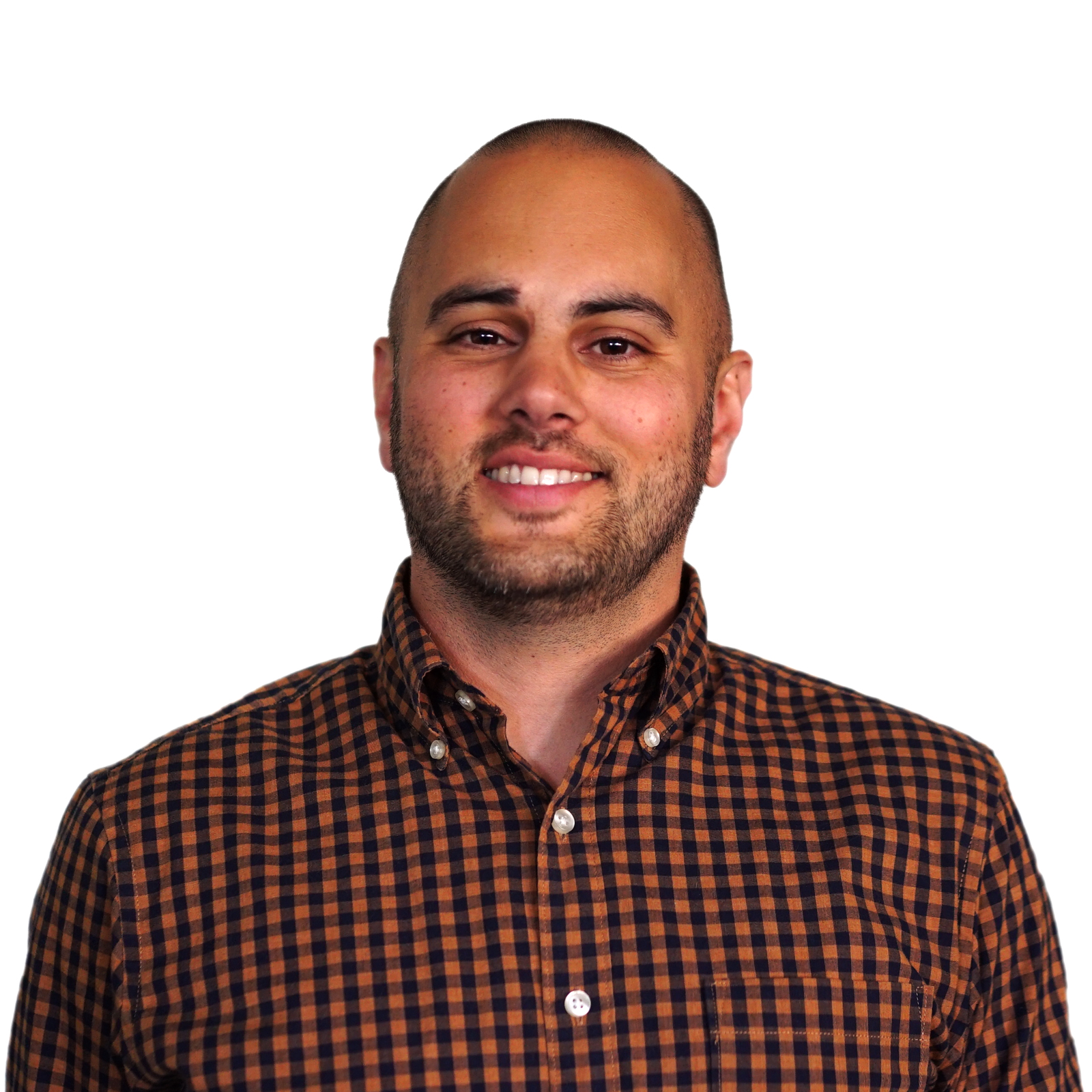 Dennis, smiling wearing a red plaid button-up shirt.