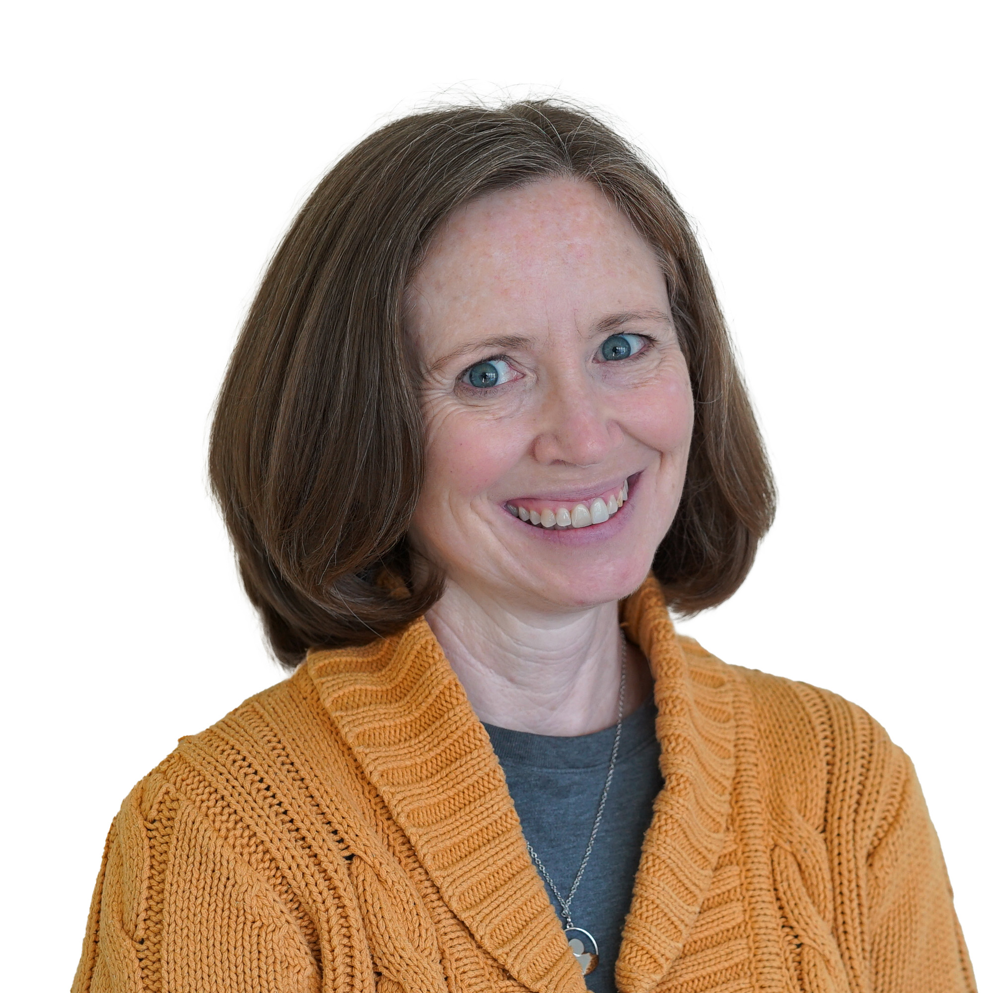 Lisa smiling, wearing a bright yellow sweater