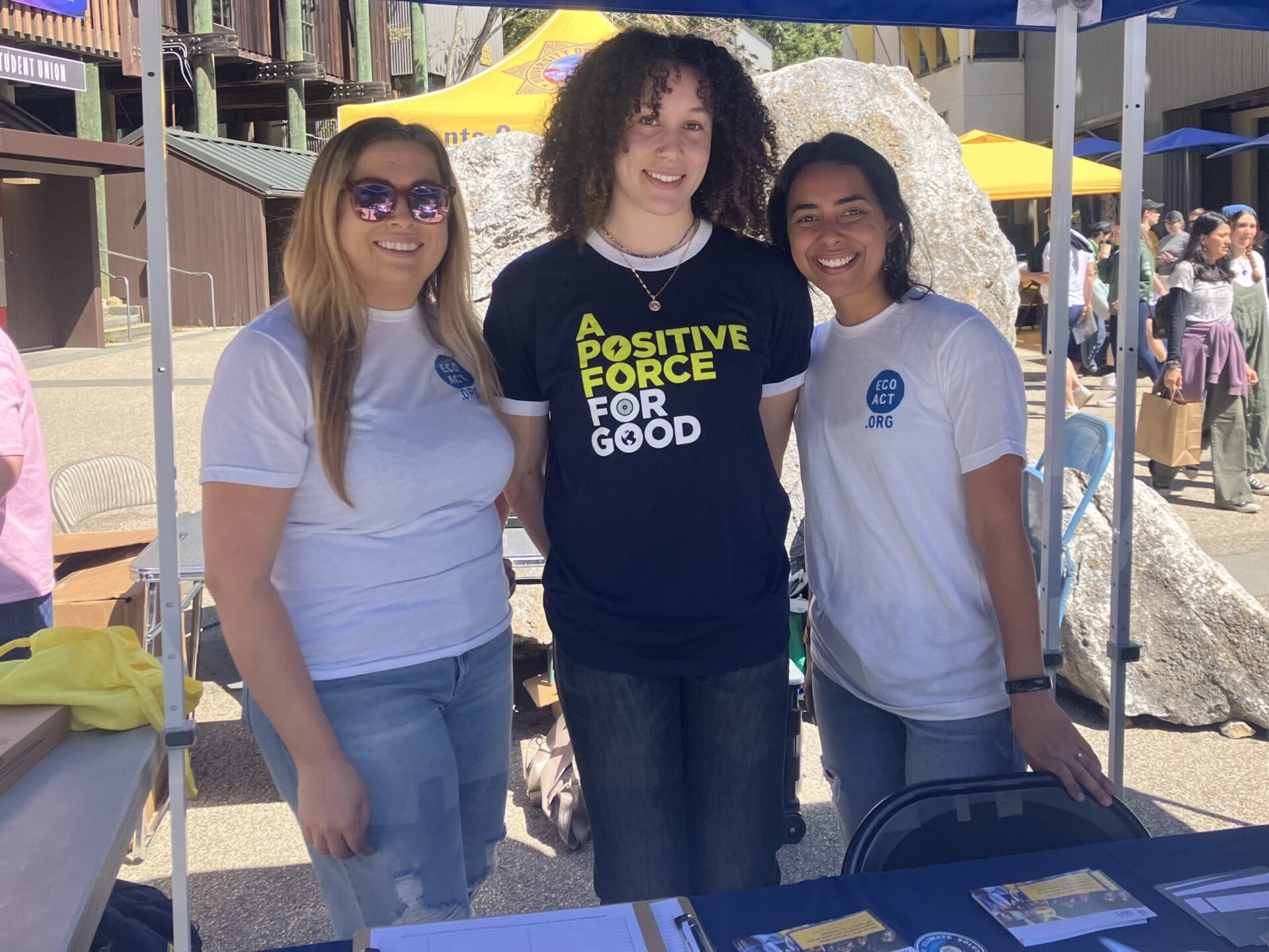 three volunteers at a community event